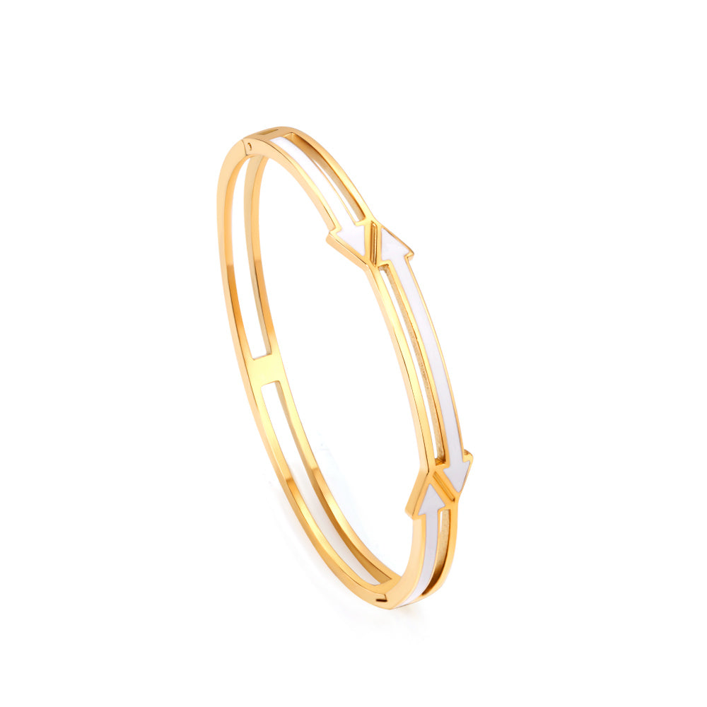 Gold colored hard bracelet with directional arrows with oil dripping in the center white color asonjewelry